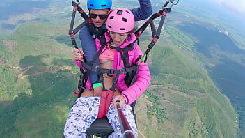 Pretty girl squirts while paragliding at 2200m high in the sky